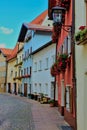 Vertical shot of colorful buildings on a paved street in Fussen, Germany