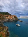 Vertical shot of the colorful coastal village of Cinque Terre, at the edge of the cliff Riomaggiore Royalty Free Stock Photo