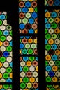 Vertical shot of a colorful glass window with round-shaped figures Royalty Free Stock Photo