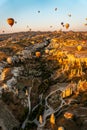 Vertical shot of colorful hot air balloons flying over Cappadocia, Turkey. Royalty Free Stock Photo