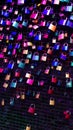 Vertical shot of colorful padlocks in neon lights in Salt Cathedral of Zipaquira, Colombia