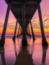 Vertical shot of the colorful sunset under the pier Royalty Free Stock Photo