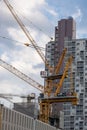 Vertical shot of construction site in Bangkok using tall cranes