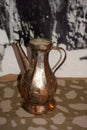 Vertical shot of a copper antique jug