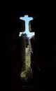 Vertical shot of a cross detail carved on the wall of Castle Manzanares el Real in Madrid, Spain