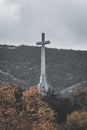 Vertical shot of Cross of the Valley of the Fallen in the mountain range of Guadarrama, Madrid