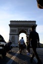 Vertical shot of a crowd of people near the historic Arc de Triomphe in Paris, France