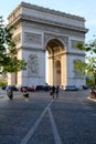 Vertical shot of a crowd of people near the historic Arc de Triomphe in Paris, France