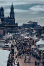 Vertical shot of the crowd on the street against the Church of the Holy Cross