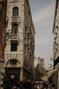 Vertical shot of the crowded street between the buildings in Venice, Italy