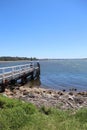 Vertical shot of a Culburra beach, south coast, Australia with a bridge under the clear sky Royalty Free Stock Photo