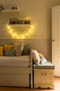 Vertical shot of a cute bedroom interior in pastel tones