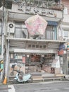 Vertical shot of a cute small street market with a scooter parked in the front, Pingxi, Taiwan