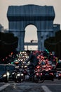 Vertical shot of the cyclist in front of the Triumphal Arch during the traffic