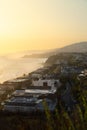 Vertical shot of Dana Point city in California at sunset with houses on the Dana Point Harbor Royalty Free Stock Photo