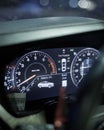 Vertical shot of the dashboard cluster of a car, showing the various gauges and dials Royalty Free Stock Photo