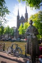 Vertical shot of the De Krijtberg church in the Netherlands, Amsterdam taken from across the river