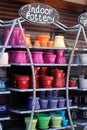 Vertical shot of decorative colorful indoor pottery in the shelfs