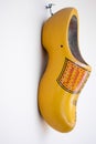 Vertical shot of a decorative yellow clog shoe Royalty Free Stock Photo