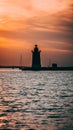 Vertical shot of the Delaware Breakwater East End Lighthouse on a sunset sky background in the USA Royalty Free Stock Photo