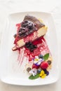 Vertical shot of a delectable slice of burnt cheesecake with berries Royalty Free Stock Photo