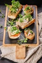 Vertical shot of delicious bruschetta and canape with turkey pate and microgreens. Traditional Mediterranean cuisine. Delicious