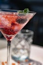 Vertical shot of delicious molecular cocktail with blackberries on a table Royalty Free Stock Photo