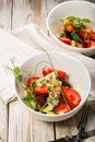 Vertical shot delicious summer salad. Salad with fresh strawberries, baked beets, yellow tomatoes, dor blue cheese and herbs in a Royalty Free Stock Photo