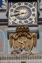 Vertical shot of the detail of the clock in the town hall tower, Old Market Square, Poznan, Poland