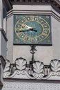 Vertical shot of the detail of the clock in the town hall tower, Old Market Square, Poznan, Poland