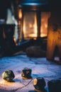 Vertical shot of dice on a map with an old lamp blurred in the background