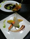 Vertical shot of different sushi  plated on a white plate with a beautiful presentation Royalty Free Stock Photo