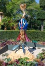 Vertical shot of a Disney cartoon character Jafar sculpture in a garden in Disneyland, France