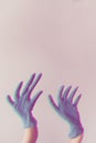 Vertical shot of distorted wavy hands behind a white background