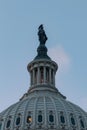 Vertical shot of the dome of the United States Capitol in Washington against the blue sky Royalty Free Stock Photo