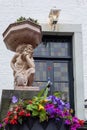 Vertical shot of a door with a statue at De Berkt Castle in the city of Baarlo in The Netherlands Royalty Free Stock Photo