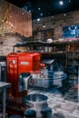 Vertical shot of a dough mixer in an Italian restaurant seen behind a window