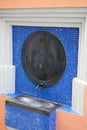 Vertical shot of drinking water fountain with flowing water in a health resort