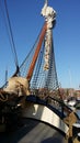 Vertical shot of a dutch flat bottom boat moored in the harbor of Harlingen Royalty Free Stock Photo