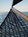 Vertical shot of a dutch flatboat in the open sea at daytime