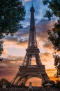 Vertical shot of the Eiffel Tower with a dreamy, scenic cloudscape in the background Royalty Free Stock Photo