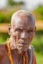 A vertical shot of a senior African American male from the traditional Dassanech tribe in Ethiopia