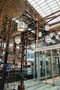 Vertical shot of elegant lamp lights hanging from the glass roof of the One Nimman mall in Thailand