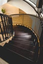 Vertical shot of an elegant turning staircase