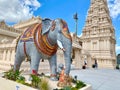 Vertical shot of an elephant statue at historic Karya Siddhi Hanuman Hindu Temple on a sunny day