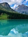 Vertical shot of the Emerald Lake against green mountains in British Columbia, Canada Royalty Free Stock Photo