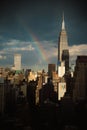 Vertical shot of the Empire State Building in New York City, rainbow over the city Royalty Free Stock Photo