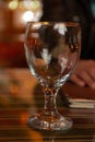 Vertical shot of an empty goblet glass on a smooth surface