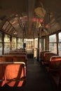 Vertical shot of an empty interior of an old tram in sunlight Royalty Free Stock Photo