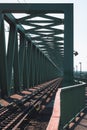 Vertical shot of an empty railway with streetlights on the side on a bright sunny day Royalty Free Stock Photo